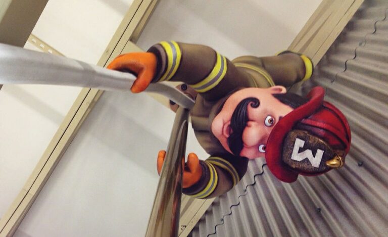 3D character of a firefighter and pole