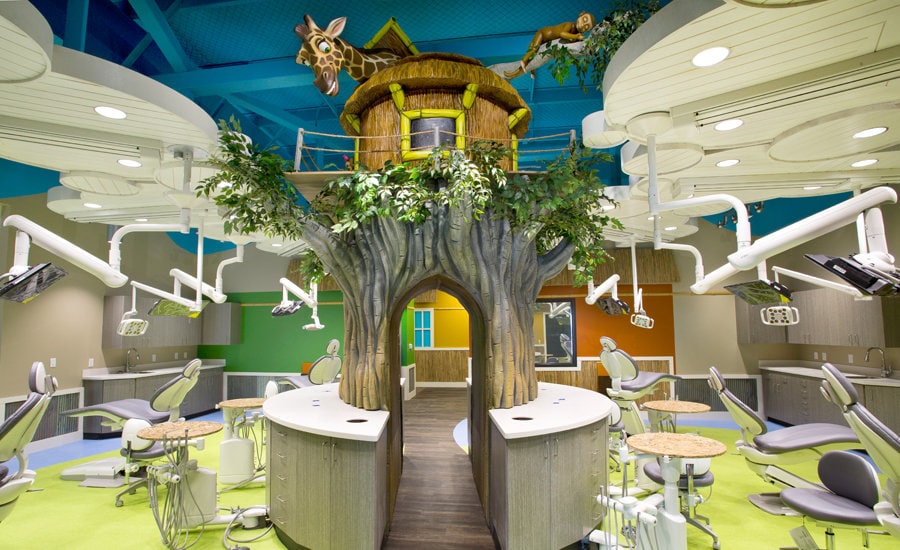 Open treatment bay area with sculpted jungle treehouse centerpiece.