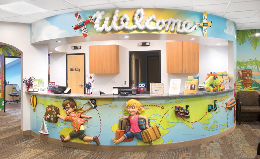 Children's custom, globetrotting-themed reception desk.