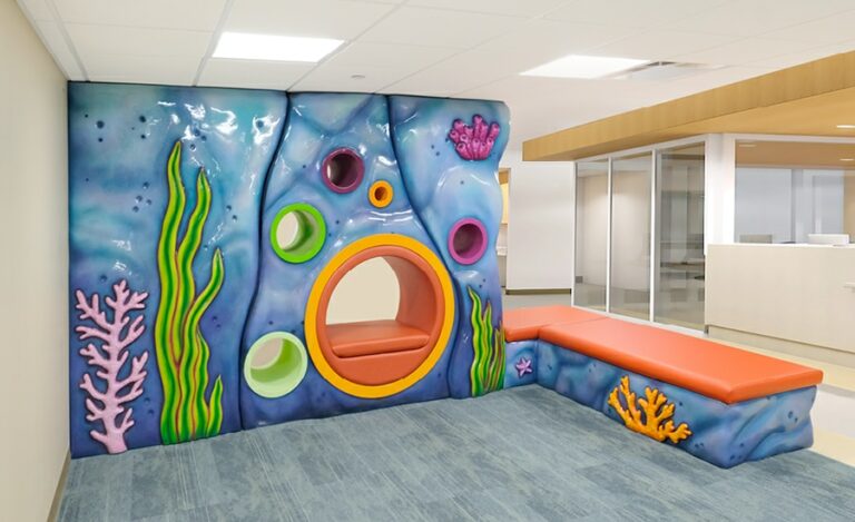 Sculpted faux rock wall with built in seating for childrens' hospital