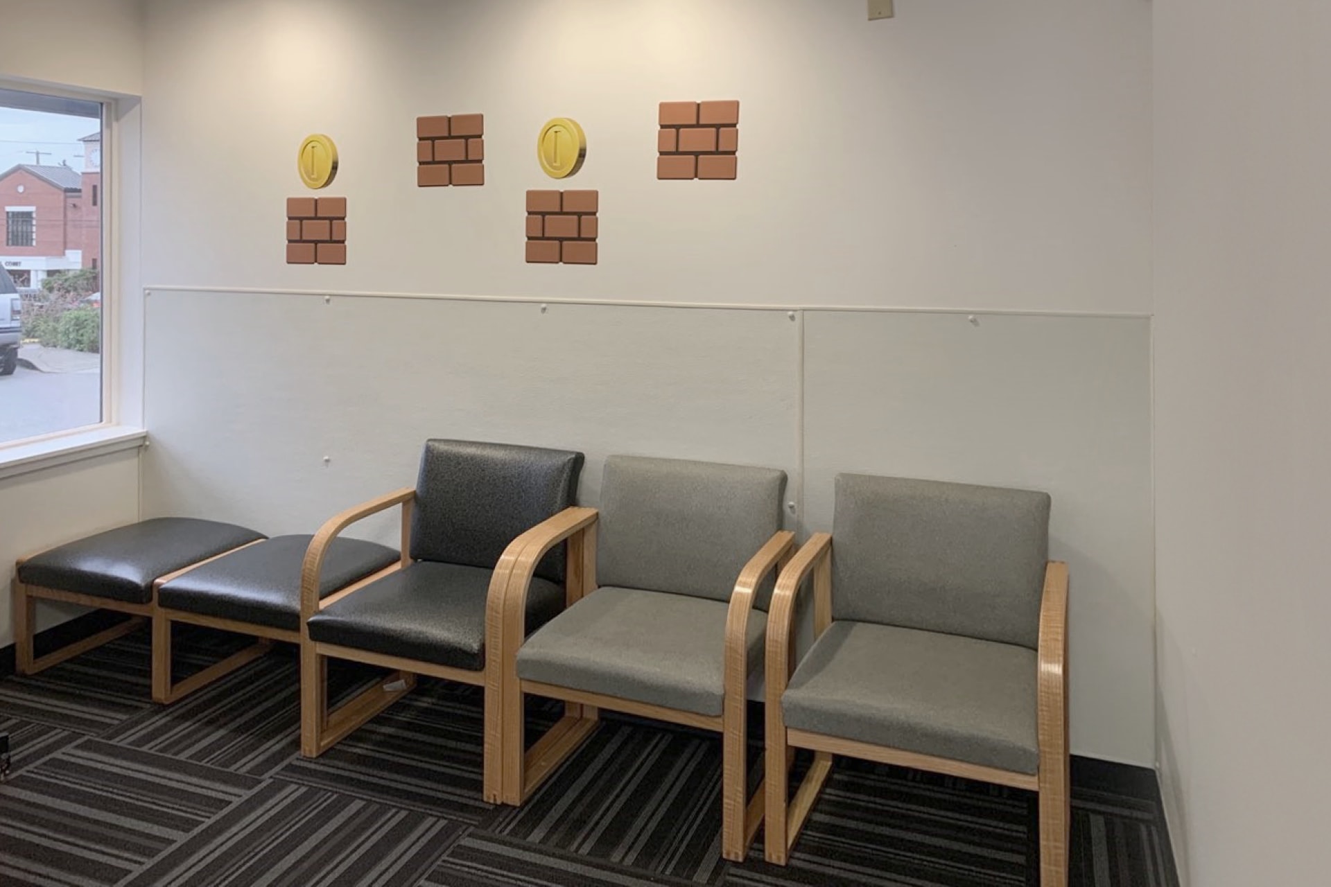 A row of drab chairs lines the room—this is a boring before photo.