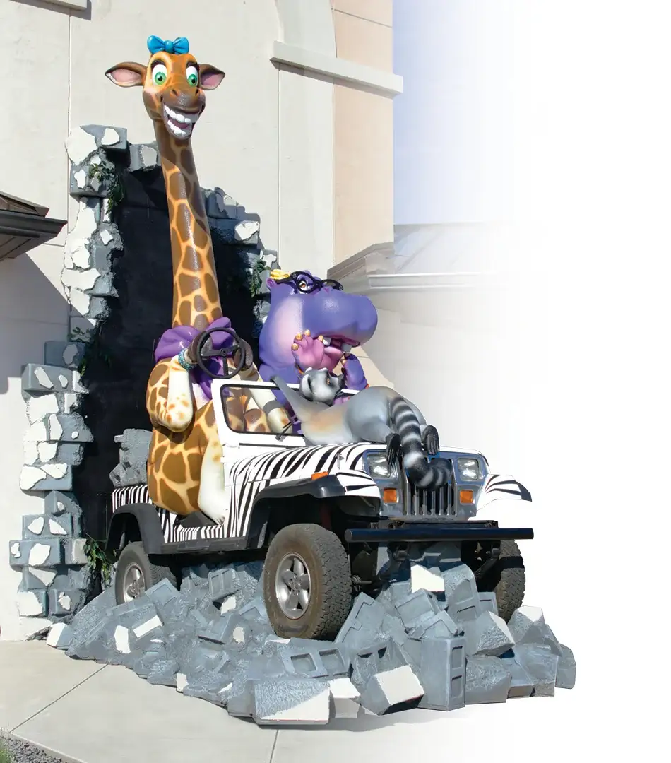 Safari themed children's play area featuring giraffe and jeep designed for pediatric dental office