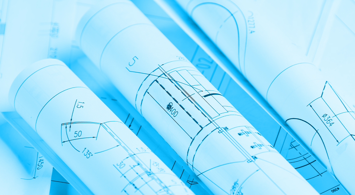 Several rolled-up blueprints with technical drawings and measurements in blue tones, showing engineering or architectural plans.