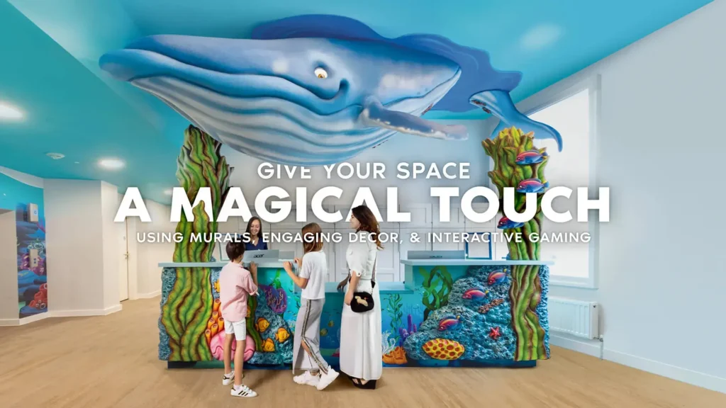 Themed pediatric reception desk with colorful mural and interactive design